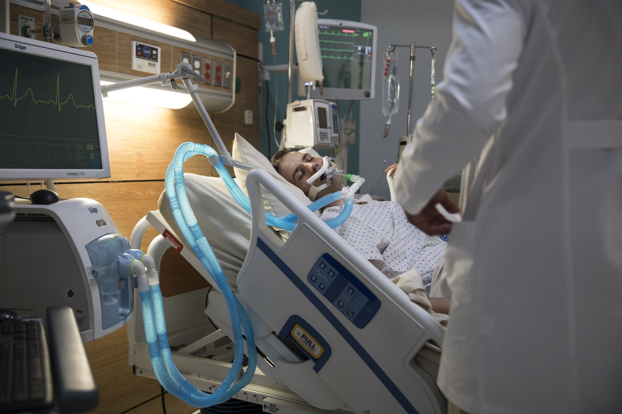 ICU patient with doctor at bedside